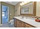 Bathroom featuring marble countertop and a large framed mirror at 295 Porto Alegre St, Punta Gorda, FL 33983