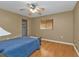 Bedroom with a ceiling fan, closet and hardwood floors at 295 Porto Alegre St, Punta Gorda, FL 33983