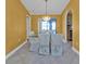 Well lit dining room showcasing a decorative chandelier and glass table at 295 Porto Alegre St, Punta Gorda, FL 33983