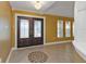 Foyer featuring decorative double doors, tiled floor with medallion, chandelier, and ample natural light at 295 Porto Alegre St, Punta Gorda, FL 33983