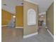 Hallway featuring decorative wall niche, tile flooring, and views into the dining and kitchen areas at 295 Porto Alegre St, Punta Gorda, FL 33983