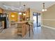 Kitchen area with breakfast bar featuring wood cabinets, tile floors, and stainless steel appliances at 295 Porto Alegre St, Punta Gorda, FL 33983