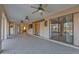 A home's lanai shows the tiled floors and leads to the home's interior with sliding glass doors at 295 Porto Alegre St, Punta Gorda, FL 33983