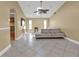 Bright living room with tile floors, neutral paint, fan, and vaulted ceilings at 295 Porto Alegre St, Punta Gorda, FL 33983