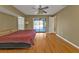 Open main bedroom with hardwood floors and access to the screened pool area at 295 Porto Alegre St, Punta Gorda, FL 33983