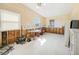 Open dining area showing tiled floor, natural lighting, and walls undergoing renovation at 3120 Wisteria Pl, Punta Gorda, FL 33950