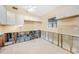 Bright kitchen featuring white cabinets and tile floor undergoing renovations at 3120 Wisteria Pl, Punta Gorda, FL 33950