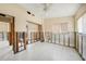 Bright room featuring tiled floors, a ceiling fan, a window and partially renovated walls at 3120 Wisteria Pl, Punta Gorda, FL 33950