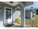 Front entrance with decorated glass door, archway, and updated landscaping at 349 Grenada St, Port Charlotte, FL 33948