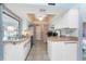 Kitchen featuring white cabinets, stainless steel appliances, wood countertop and decorative ceiling at 349 Grenada St, Port Charlotte, FL 33948