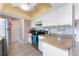 Kitchen featuring white cabinets, stainless steel appliances, wood countertop and decorative ceiling at 349 Grenada St, Port Charlotte, FL 33948