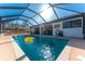 Screened-in swimming pool offers a relaxing oasis with ample space for lounging at 349 Grenada St, Port Charlotte, FL 33948