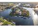 Stunning aerial view of waterfront homes with private boat docks surrounded by tranquil canals and lush landscaping at 3612 Licata Ct, Punta Gorda, FL 33950