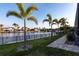 Backyard showing a view of the water, tropical landscaping, and a paved walkway at 3612 Licata Ct, Punta Gorda, FL 33950