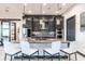 Well-lit kitchen with stainless steel appliances, shaker cabinets, granite countertops, and pendant lights over the island at 3612 Licata Ct, Punta Gorda, FL 33950