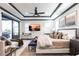 Elegantly designed main bedroom featuring a tray ceiling, a TV, and a seating area at 3612 Licata Ct, Punta Gorda, FL 33950