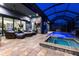 Stunning covered patio with pool, spa, and open living concept for seamless indoor/outdoor living at 3612 Licata Ct, Punta Gorda, FL 33950