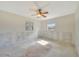 Bright bedroom with ceiling fan and natural light from windows at 3615 Sleepy Hollow Ln, Punta Gorda, FL 33950