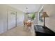 Cozy dining area with table and chairs, lit by stylish pendant lighting, next to doorway at 3615 Sleepy Hollow Ln, Punta Gorda, FL 33950