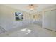 Open living room with ceiling fan, connecting to other rooms of the home at 3615 Sleepy Hollow Ln, Punta Gorda, FL 33950