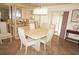 This dining room features a classic hutch, tile flooring, neutral tones and a modern light fixture at 4000 Bal Harbor Blvd # 527, Punta Gorda, FL 33950