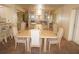 This dining room features a classic hutch, tile flooring, neutral tones and a view into the kitchen at 4000 Bal Harbor Blvd # 527, Punta Gorda, FL 33950