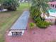 Enjoy outdoor recreation with this well-maintained bocce ball court surrounded by greenery at 10256 Shadow Run Ct, Punta Gorda, FL 33955