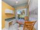 Bright breakfast nook with table, chairs, and window overlooking the yard at 10256 Shadow Run Ct, Punta Gorda, FL 33955