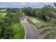 Aerial shot of a gated community entrance featuring lush greenery, manicured landscaping, and a secured entry point at 10256 Shadow Run Ct, Punta Gorda, FL 33955
