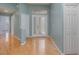 Bright foyer with light hardwood floors, a double door entry, and neutral paint at 10256 Shadow Run Ct, Punta Gorda, FL 33955