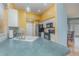 A well-lit kitchen area features green countertops, white cabinets, and stainless steel appliances at 10256 Shadow Run Ct, Punta Gorda, FL 33955