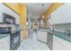 A kitchen with ample counter space, a dishwasher, and views to the breakfast nook at 10256 Shadow Run Ct, Punta Gorda, FL 33955