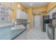 View of the kitchen featuring countertops, white cabinets, and stainless steel appliances at 10256 Shadow Run Ct, Punta Gorda, FL 33955