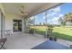 Screened-in lanai providing scenic views of the lush greenery and blue sky at 10256 Shadow Run Ct, Punta Gorda, FL 33955