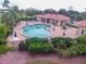 Inviting community pool area with ample seating and lush landscaping at 10256 Shadow Run Ct, Punta Gorda, FL 33955