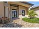 Inviting entrance with double doors, manicured shrubs, and a stone-paved walkway leading to the front door at 1139 Harbour Glen Pl, Punta Gorda, FL 33983