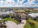 Aerial view of community waterfront homes, lush landscaping and boat docks at 1217 Bobwhite Court, Punta Gorda, FL 33950