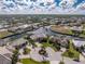 An aerial view of a waterfront community with canals and lush landscaping at 1217 Bobwhite Court, Punta Gorda, FL 33950