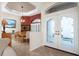 Dining area featuring tile floors, a wooden table with chairs, and French doors at 1217 Bobwhite Court, Punta Gorda, FL 33950