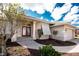Welcoming front entrance with a red double door, beautiful landscaping, and a brick walkway to the garage at 1217 Bobwhite Court, Punta Gorda, FL 33950