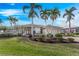Beautiful single Gathering home with manicured front yard and an attached 2-car garage at 1217 Bobwhite Court, Punta Gorda, FL 33950