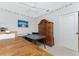 Office space with hardwood hutch, blue accent wallpaper and a ceiling fan at 1217 Bobwhite Court, Punta Gorda, FL 33950