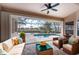 Inviting screened-in patio with comfortable seating overlooking a private pool and picturesque canal at 1217 Bobwhite Court, Punta Gorda, FL 33950