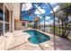 Gorgeous screened-in pool with serene views of the canal and boat dock at 1217 Bobwhite Court, Punta Gorda, FL 33950
