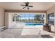 Relaxing outdoor pool area with screen enclosure and scenic waterfront views at 1217 Bobwhite Court, Punta Gorda, FL 33950