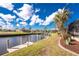 Picturesque waterfront view with private boat dock under sunny skies at 1217 Bobwhite Court, Punta Gorda, FL 33950