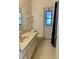 Bathroom featuring a sink with vanity and a door to the outside at 20408 Andover Ave, Port Charlotte, FL 33954
