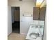 Bathroom with double sinks and a large mirror, providing plenty of counter space at 20408 Andover Ave, Port Charlotte, FL 33954