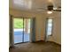 Bedroom featuring a ceiling fan and glass sliding doors leading to the patio at 20408 Andover Ave, Port Charlotte, FL 33954