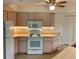 Well-lit kitchen features modern appliances, wood counters, and ample cabinet space at 20408 Andover Ave, Port Charlotte, FL 33954